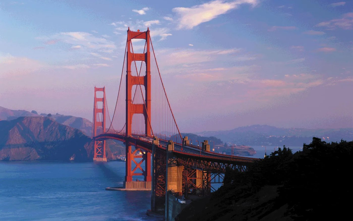 The Golden Gate Bridge at dusk, looking across the San Francisco Bay